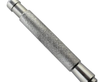May include: A silver metal tool with a textured grip and a pointed tip. The tool is used for pushing out watch pins.