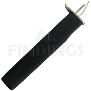 May include: A black and silver tool with a long handle and a small, pointed tip. The tool is designed for pulling wire through tight spaces.