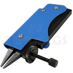 May include: Blue and black pliers with a screw adjustment knob. The pliers have a blue handle and a black jaw.
