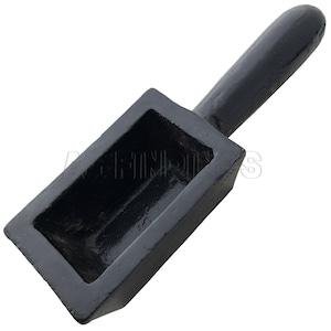 May include: Black metal casting mold with a wooden handle. The mold has a rectangular shape with a deep cavity for pouring molten metal.