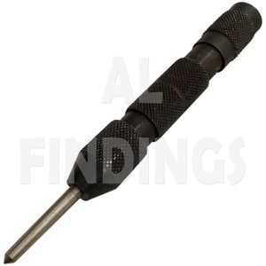 May include: A black metal center punch tool with a pointed tip and a textured grip.