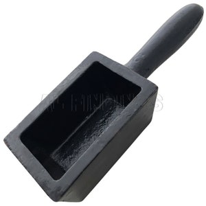 May include: A black cast iron mold with a wooden handle. The mold is rectangular and has a smooth, shiny surface. It is designed to create bars of metal.
