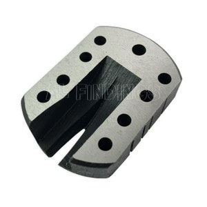 May include: A silver metal U-shaped tool with a black center and multiple holes around the edges. The tool is designed for jewelry making.