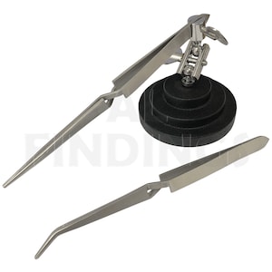 May include: A silver-colored, adjustable, multi-purpose, third hand tool with a black base and two pairs of tweezers. The base is a stack of three round black discs. The tweezers are made of metal and have a pointed tip.