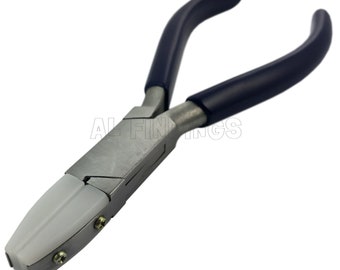 May include: A pair of silver-toned pliers with blue rubber handles and white plastic jaws. The pliers are designed for jewelry making.