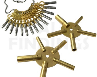 May include: A set of 18 gold-toned clock winding keys with a silver-toned shaft, attached to a chain. The keys are also sold individually on a gold-toned star-shaped holder.