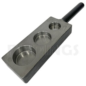 May include: A metal tool with a black handle and three circular cutouts. The tool is used for making round shapes.