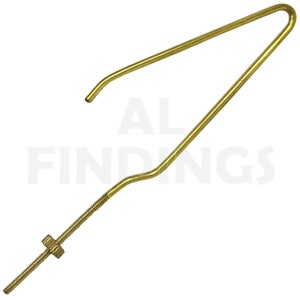 May include: A brass-colored jewelry finding with a curved, angled design. The piece features a threaded rod with a nut and a bent wire component. The text "AL FINDINGS" is visible in the background.