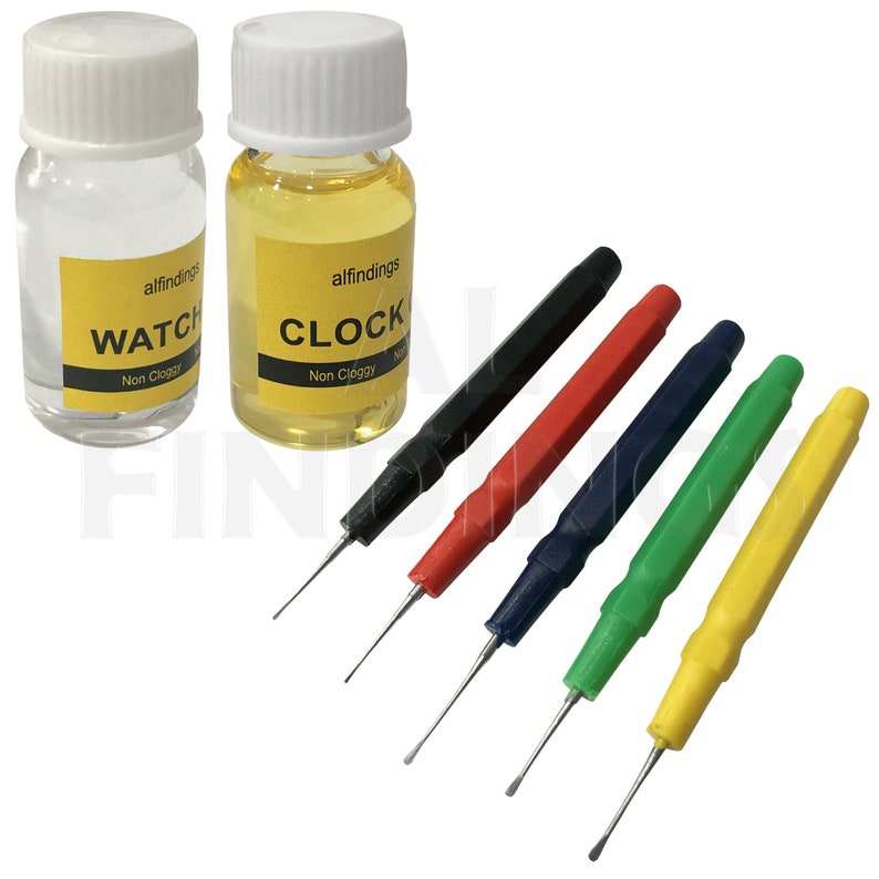 May include: Two small bottles of watch and clock oil, labeled "alfindings WATCH Non Cloggy" and "alfindings CLOCK Non Cloggy", with five different colored tools for watch and clock repair.