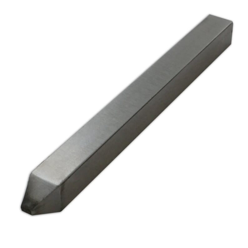 May include: A silver metal turning tool with a pointed tip. The tool is rectangular in shape and has a brushed finish.