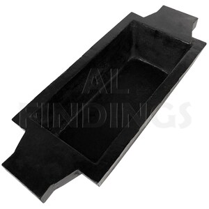 May include: Black rectangular metal mold with two handles on either end. The mold is designed for casting metal.