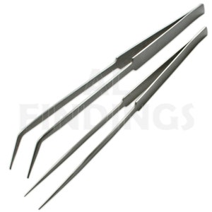 May include: Three stainless steel tweezers with angled tips. The tweezers are arranged in a row, with the longest one at the top and the shortest one at the bottom.