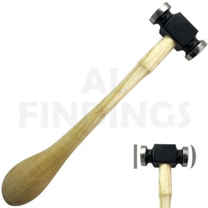 May include: A black metal hammer with a wooden handle. The hammer has two round faces and is used for shaping metal.