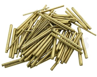 May include: A pile of brass rods of various lengths, some are longer than others, all are shiny and gold in color.