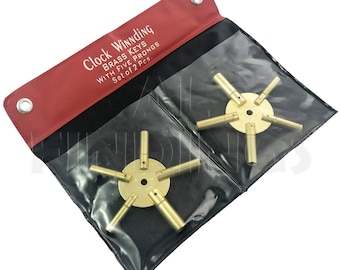 May include: Set of two brass clock winding keys with five prongs each. The keys are in a red and black pouch with the text "Clock Winding Brass Keys with Five Prongs Set of 2 Pcs."