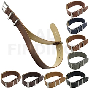 May include: A set of ten leather watch straps in various colors, including brown, navy, gray, and black. The straps are shown in both a flat and a curved configuration. Each strap has a silver buckle and stitching.