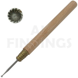 May include: A wooden handled tool with a metal tip. The tip has a small, round, serrated head. The tool is used for making small holes in metal.