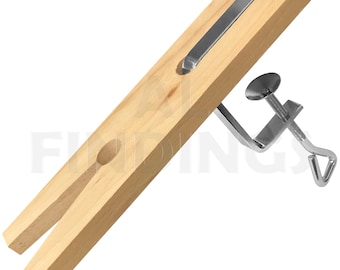 May include: A wooden ring mandrel with a metal clamp. The mandrel has a slot for holding a ring and a metal bar for tightening the clamp.