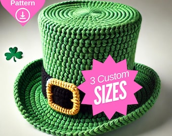 May include: A green crochet leprechaun hat with a black band and gold buckle. The hat has a wide brim and a cylindrical crown. A pink heart-shaped graphic with "PDF Pattern" and a download icon is in the upper left corner. A pink starburst graphic with "3 Custom SIZES" is on the right.