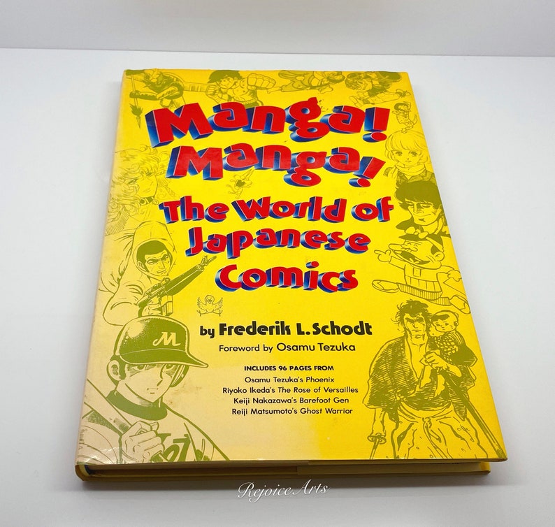 Puede incluir: Un libro amarillo titulado "Manga! Manga! El mundo del c&oacute;mic japon&eacute;s" de Frederik L. Schodt con un pr&oacute;logo de Osamu Tezuka. La portada del libro presenta ilustraciones de personajes de varios c&oacute;mics japoneses.