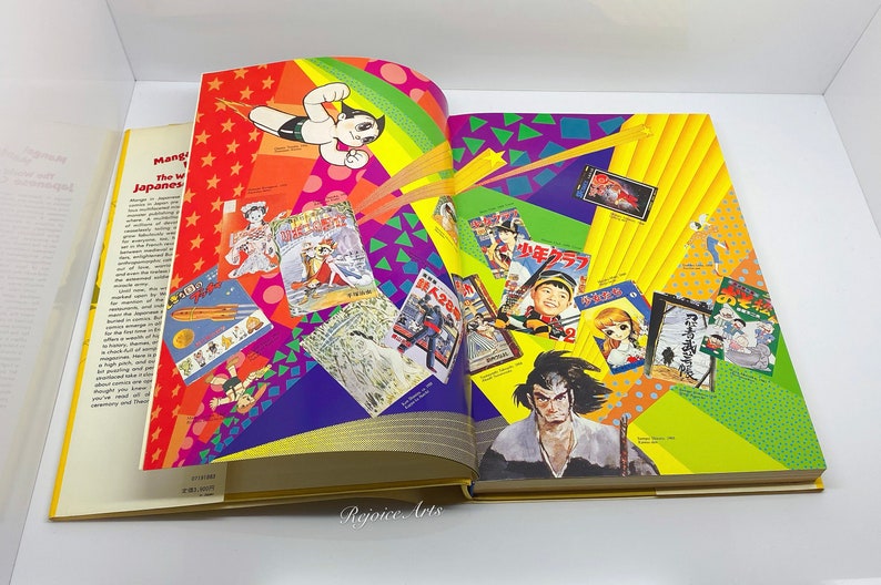 Puede incluir: Un libro abierto con una portada colorida que presenta personajes e ilustraciones de manga japon&eacute;s. El t&iacute;tulo del libro es "Manga! El mundo del c&oacute;mic japon&eacute;s".