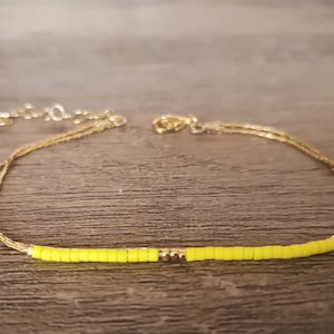 Double bracelet gold-plated with 1 micron gold and fluo yellow glass beads