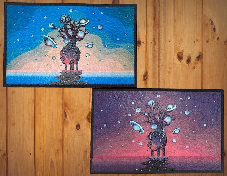 May include: Two colorful doormats with a tree growing out of a planet surrounded by planets and bubbles. The top doormat has a blue background with a pink and white sky. The bottom doormat has a purple background with a pink and orange sky.