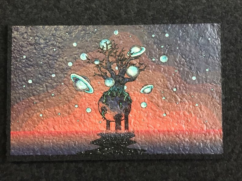 May include: A painting of a dark tree with a large, round, blue and green planet at its base. The tree is surrounded by smaller, round, blue and green planets with rings. The background is a gradient of orange, red, and purple.