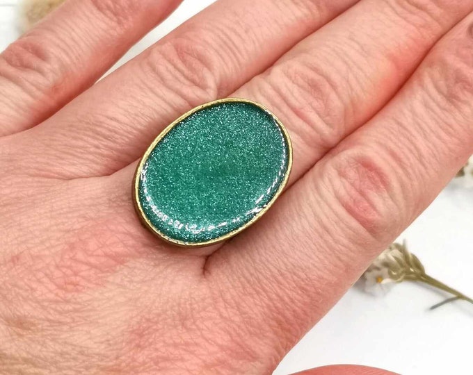 Oval cabochon epoxy resin ring, glittery green