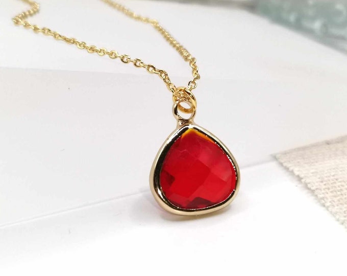 Fine, golden necklace, red glass drop