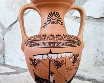 Amphora shape vase, glazed and  decorated with black figured designs