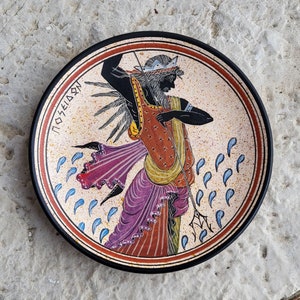 Handmade and free hand painted plate decorated in Archaic style