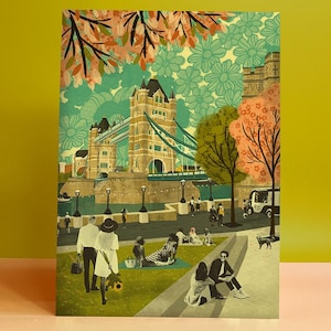 May include: A colourful illustration of Tower Bridge in London with a floral background. People are shown enjoying a picnic in front of the bridge, with a food van and trees in the foreground.