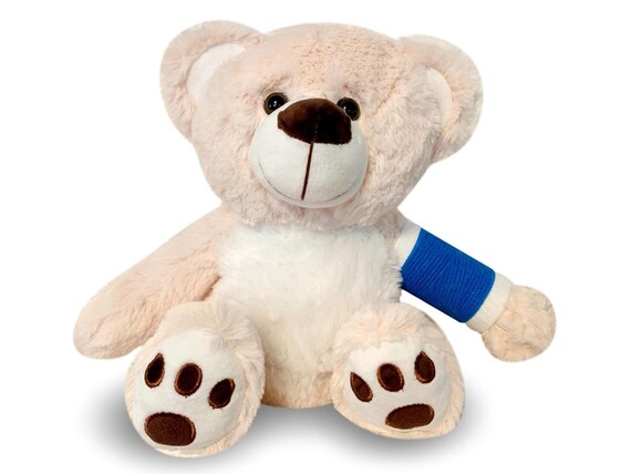 teddy bear with broken arm
