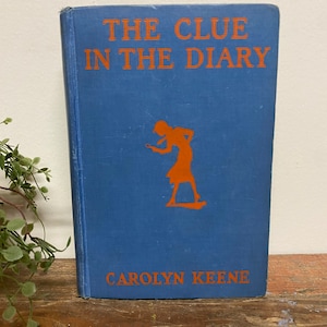 Vintage Nancy Drew Book..,Mystery. Novel. Carolyn Keene. Mildred Benson. Sleuth. Hardcover. Blue. Orange. Silhouette. Illustration. 1930-40s