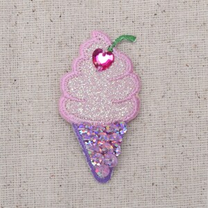 May include: Pink and purple glitter ice cream cone applique with a pink heart on top.