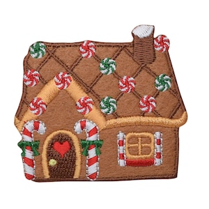 May include: A gingerbread house with a brown roof, white chimney, red and green candy, and a red heart door. The house is decorated with candy canes and green leaves.