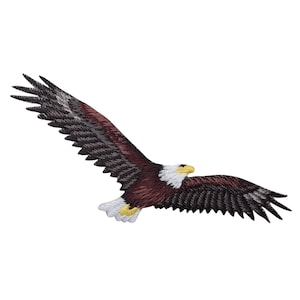 May include: Embroidered patch of a brown and white bald eagle in flight with yellow beak and feet.