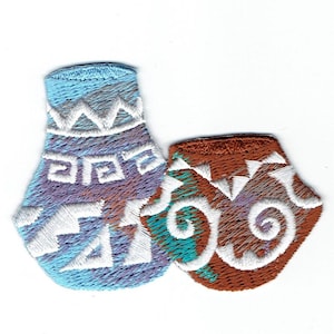 May include: Two embroidered patches depicting stylized pottery. One is blue with white geometric designs, the other is brown with white swirls.