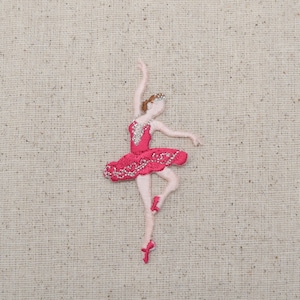 May include: Embroidered iron-on patch of a ballerina in a pink tutu with a silver crown.