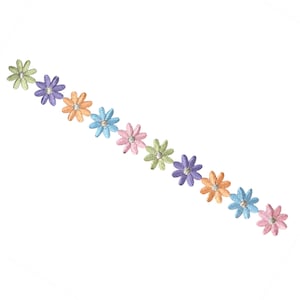 May include: A row of pastel colored embroidered flowers with a single rhinestone in the center of each flower.