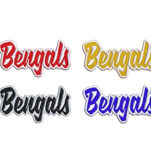 May include: Four embroidered patches with the word "Bengals" in different colors: red, yellow, black, and blue. The patches have a white outline.