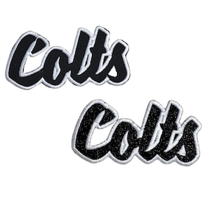 May include: Two embroidered patches with the word "Colts" in a script font. The patches are black with white trim. One patch has a textured, glittery appearance.