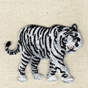 May include: White tiger embroidered patch with black stripes. The tiger is walking with its head turned to the side.