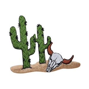 May include: An embroidered patch featuring two green cacti and a white cow skull with brown horns, set against a tan desert background.