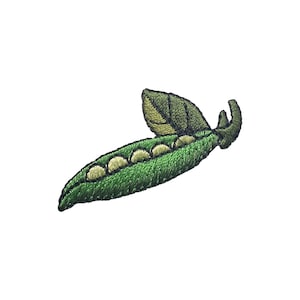 May include: A green pea pod with five peas inside and a green leaf on top. The pod is embroidered with green and black thread.