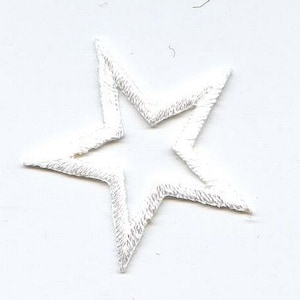 May include: White embroidered star patch. The star is outlined in white thread and has a hollow center.