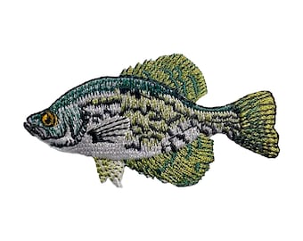 May include: Embroidered patch of a green and white crappie fish with yellow fins. The fish is facing right and has a detailed design.