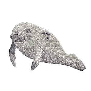 May include: A white embroidered patch of a manatee, a large, gray, aquatic mammal with flippers and a rounded tail.