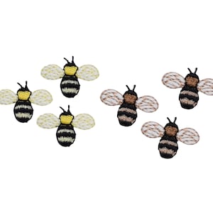 May include: Six embroidered bee patches, three with yellow and black stripes and three with brown and black stripes. The bees have white wings with black stitching.